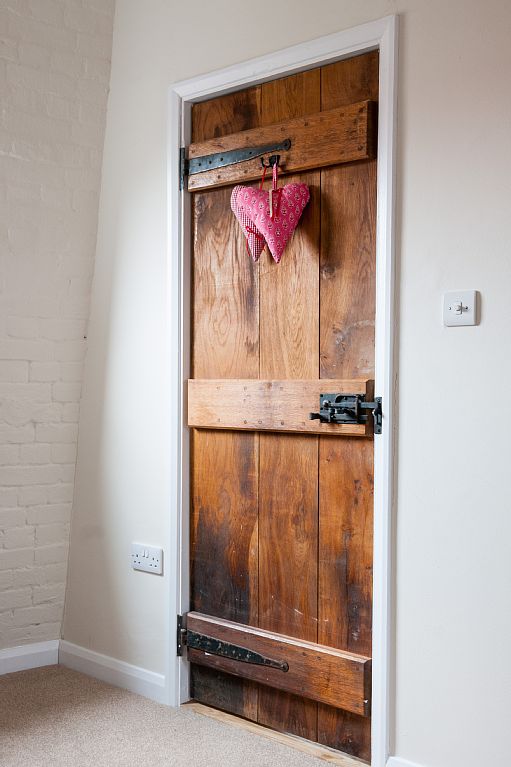 Wooden doors with hearts on.