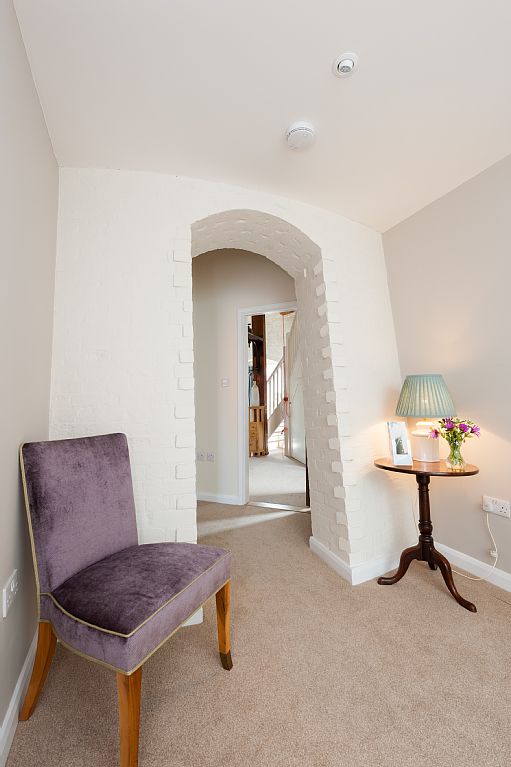 Large archways to bedroom.